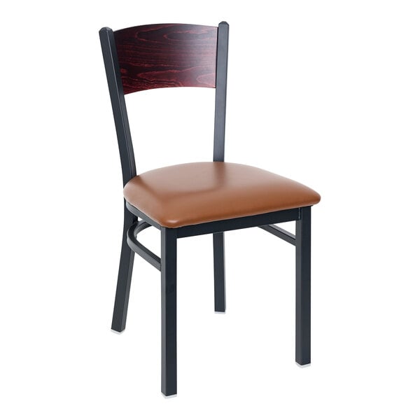 A BFM Seating black metal side chair with mahogany wooden back and light brown vinyl seat.