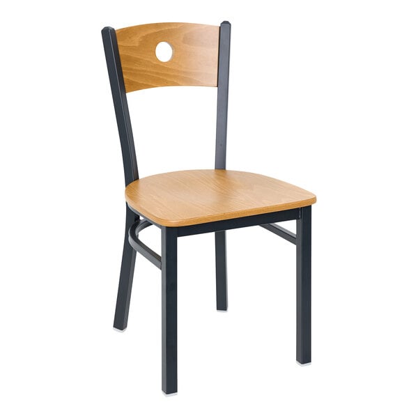 A BFM Seating black metal side chair with a cherry wooden seat and back.