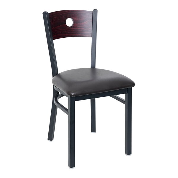 A black BFM Seating metal side chair with mahogany wood back and black vinyl seat.