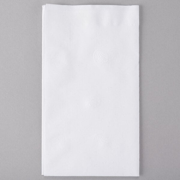 A white Response Eco-Friendly Dinner Napkin on a gray surface.