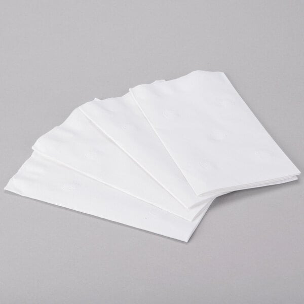 A stack of white Response 2-Ply Eco-Friendly Dinner Napkins.