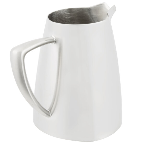 A Vollrath stainless steel open creamer with a handle.