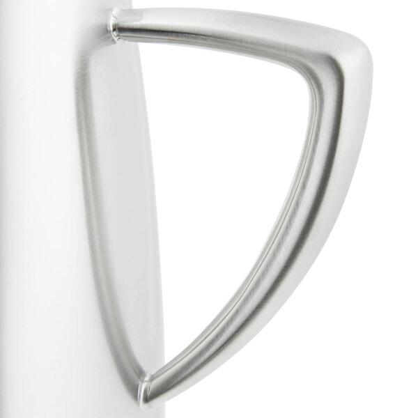 A Vollrath stainless steel open creamer with a handle.