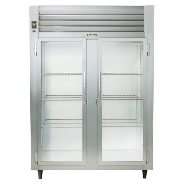 A Traulsen specification line stainless steel reach in heated holding cabinet with two glass doors.