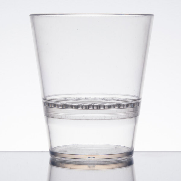 A clear plastic WNA Comet FunFusions rocks glass with a clear rim.