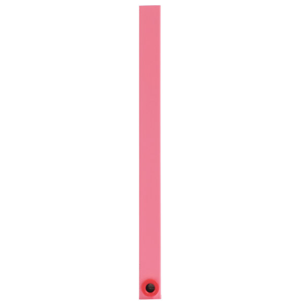 A pink rectangular object with a white border and a black button on it.