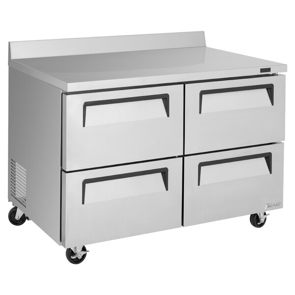 A stainless steel Turbo Air worktop refrigerator with four drawers.
