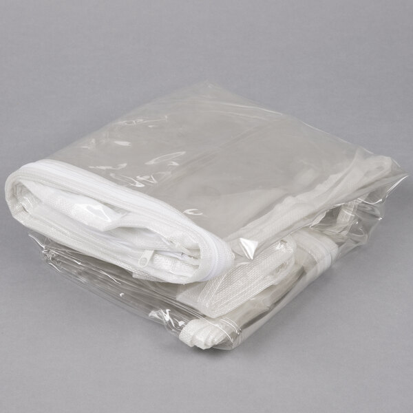 A stack of Curtron clear plastic bun pan rack covers.