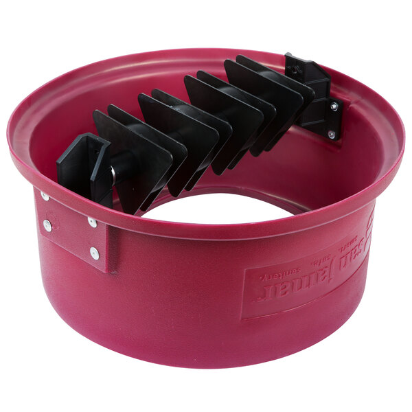 A red circular lid with black magnets on it.