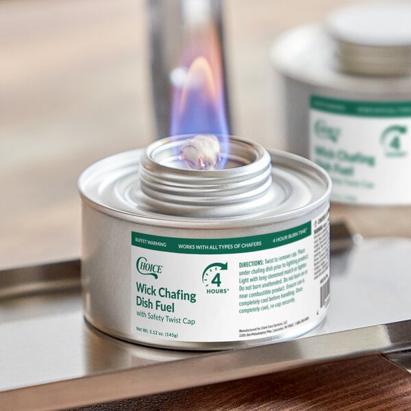 A can of Choice 4 Hour Wick Chafing Dish Fuel with a visible flame and safety twist cap.