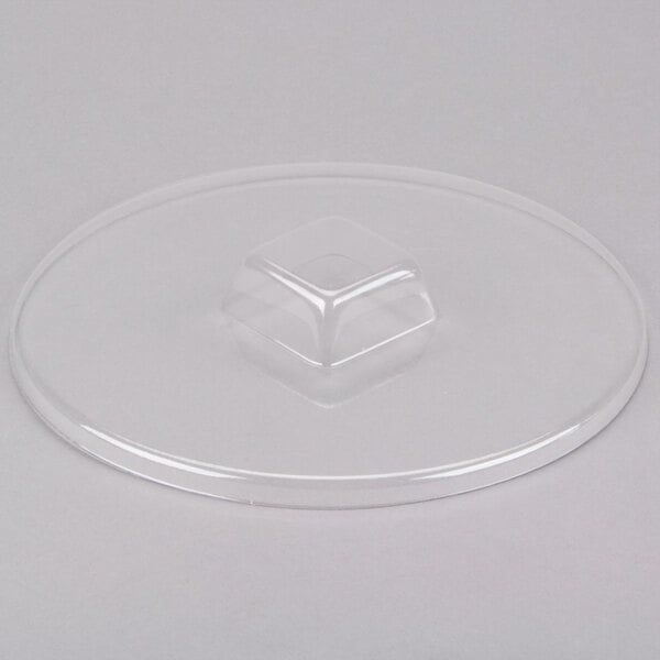 A clear plastic lid with a circular base.