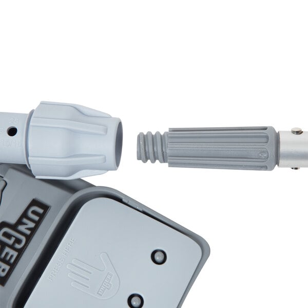 A close-up of a Unger floor cleaning kit connector.