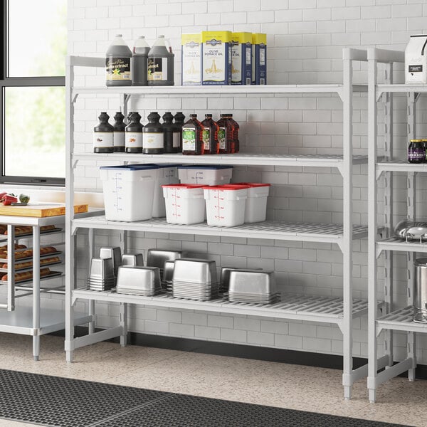 A Cambro Premium Camshelving unit with vented shelves holding containers and food items.