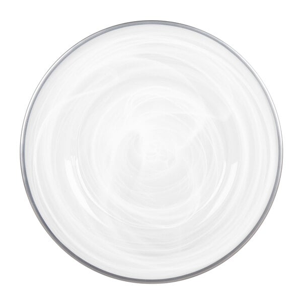 A round, white plate with a subtle swirling pattern and a silver rim, viewed from above.