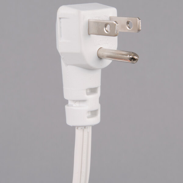 A white rectangular plug with metal prongs.