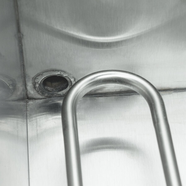 A Paragon stainless steel electric countertop fryer with a metal handle and a hole in the middle.