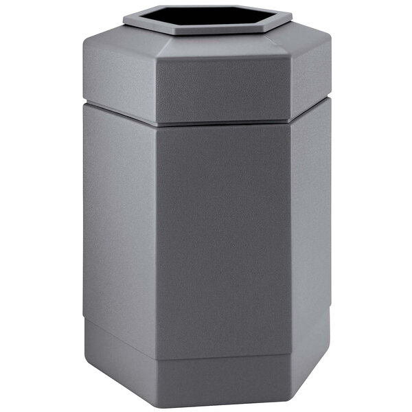 A grey hexagonal waste container with an open top.