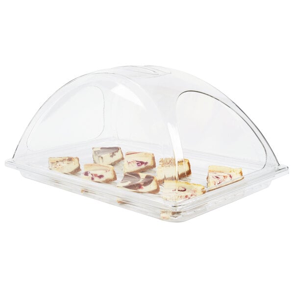 A Sterno clear plastic dome chafer cover over food.