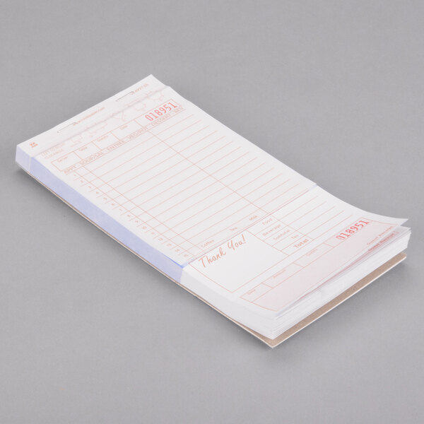A close up of a Choice tan and white carbonless guest check receipt book.