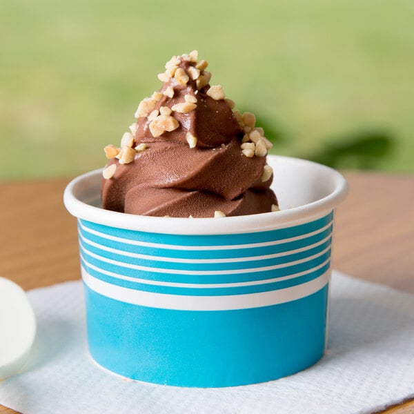 A blue Choice paper cup filled with chocolate ice cream.