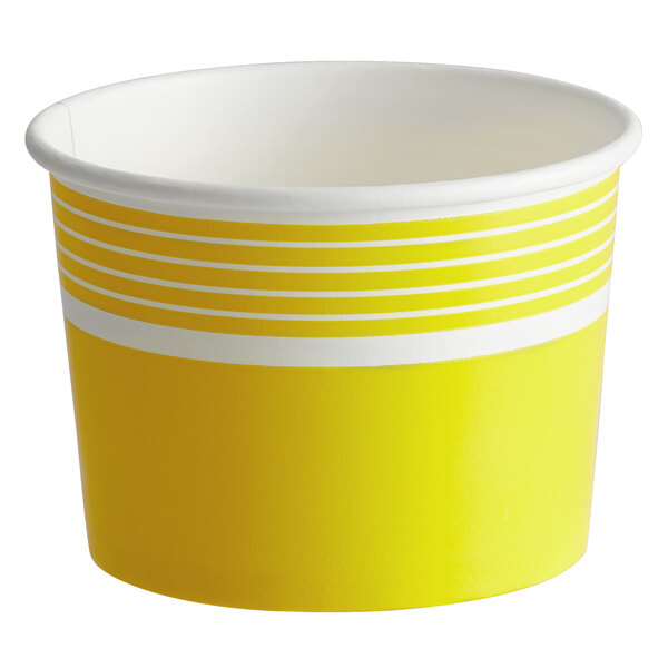 A yellow paper frozen yogurt or food cup with white stripes near the rim.