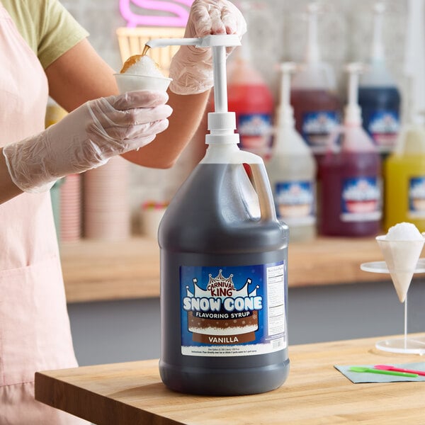 A large jug of Carnival King vanilla snow cone flavoring syrup with a pump dispenser.