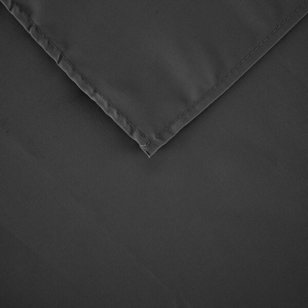 A close up of a black rectangular table cover with a folded hem.