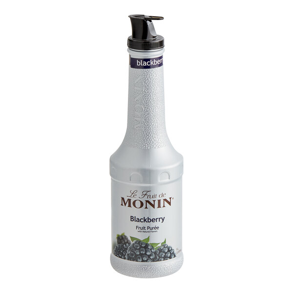 A white Monin bottle of blackberry fruit puree with a black lid.
