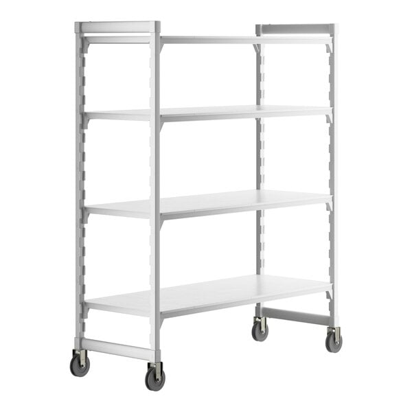 A white Cambro Camshelving Premium mobile shelving unit with 4 solid shelves and wheels.