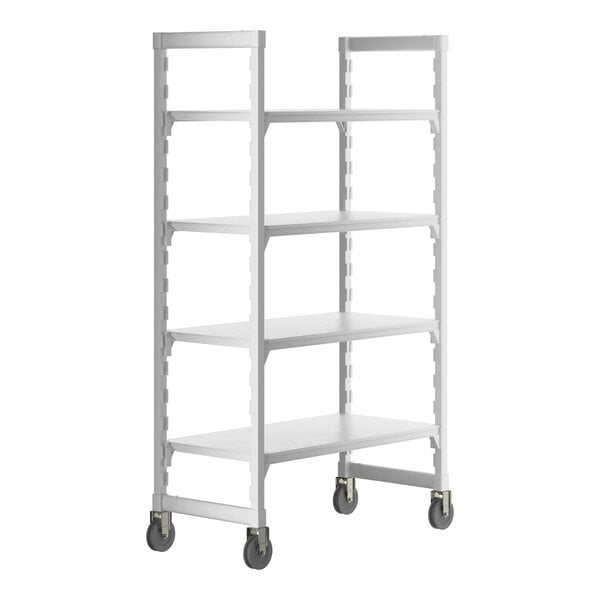 A white plastic Cambro Camshelving Premium mobile shelving unit with 4 shelves on wheels.