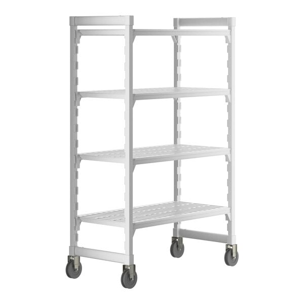 A white plastic Cambro Camshelving® Premium mobile shelving unit with wheels.