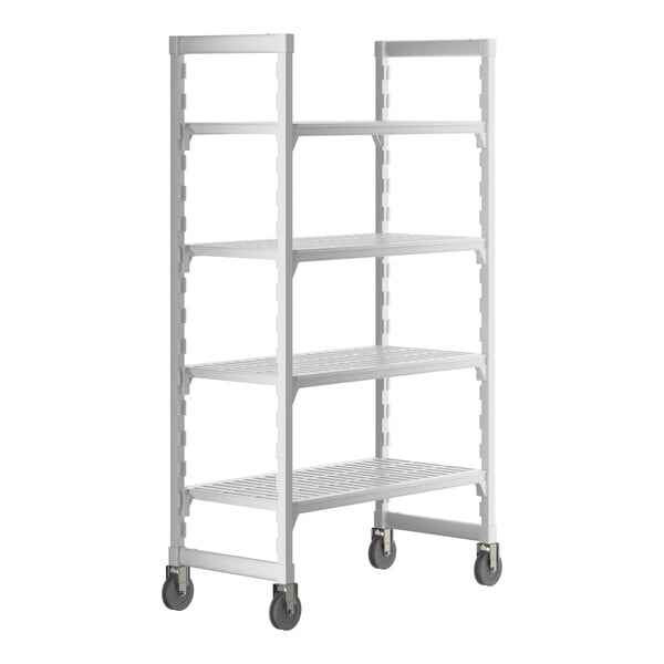 A white plastic Cambro Camshelving® Premium mobile shelving unit with 4 vented shelves and wheels.