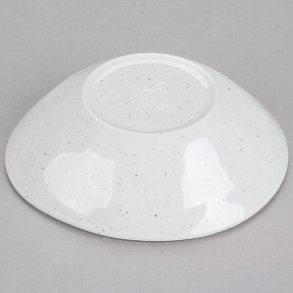 A white bowl with speckled surface.