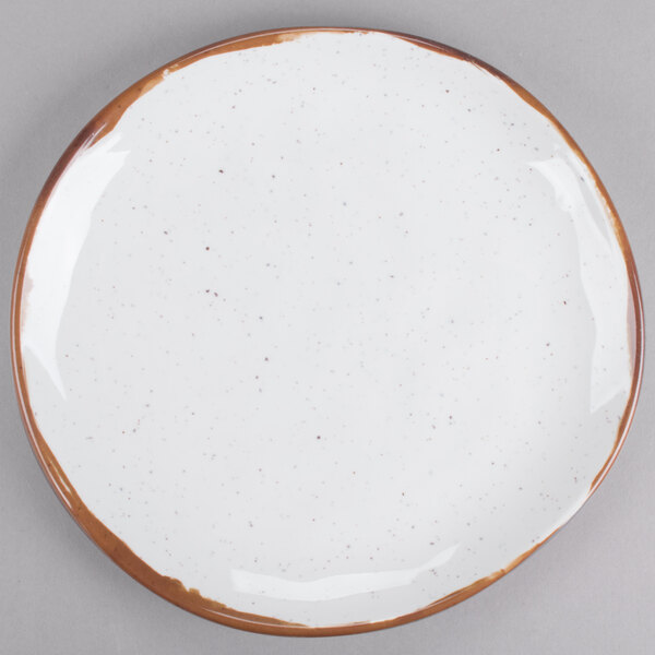 A white GET Rustic Mill melamine plate with brown speckled edges.