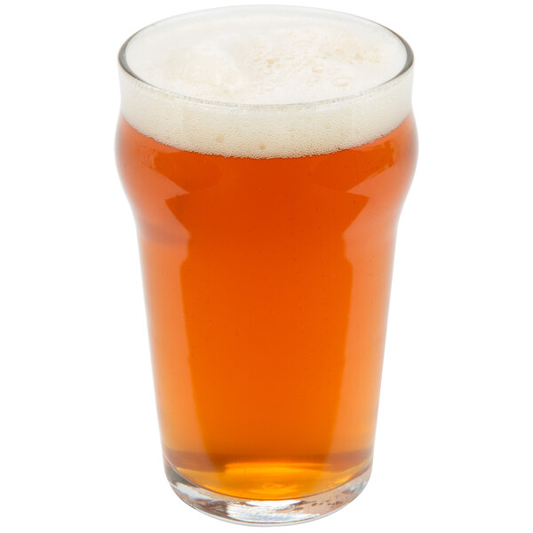 A Libbey English Pub glass of beer with foam.