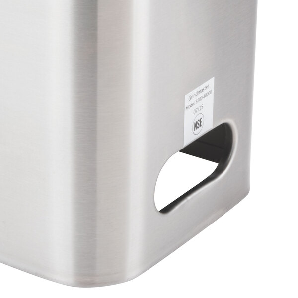 A close-up of a stainless steel Grindmaster iced tea dispenser.