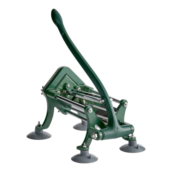 A green manual French fry cutter with a long handle and four suction feet for stability.