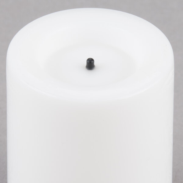 A white Sterno real wax mini votive candle.