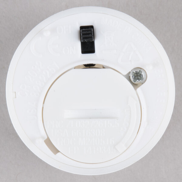 A round white Sterno votive.