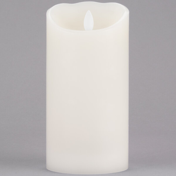 A cream colored Sterno Mirage flameless LED candle.
