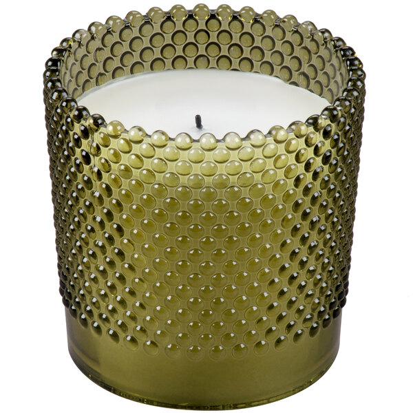 A Sterno green flameless wax filled glass lamp with a hobnail design.