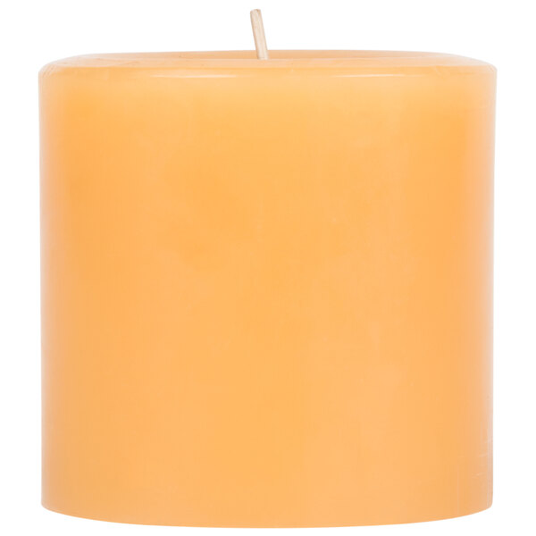 A close up of a Sterno beeswax pillar candle with a wooden stick sticking out of it.