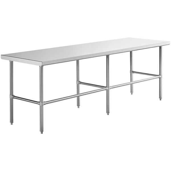 A white rectangular table with a Regency stainless steel open base.