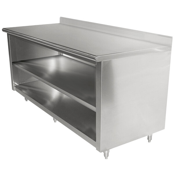 A stainless steel Advance Tabco work table with shelves.