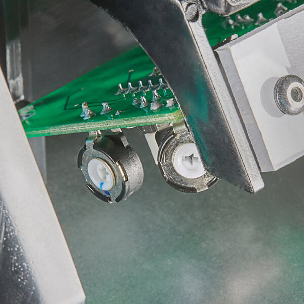 An American Dryer stainless steel hand dryer.