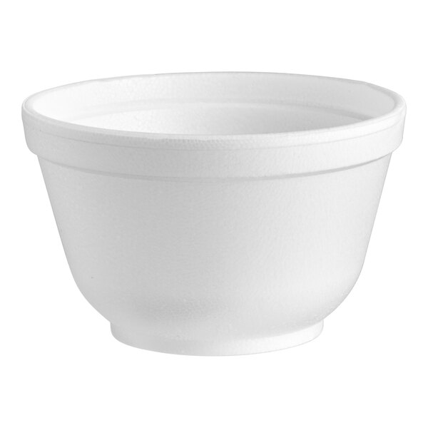 A close up of a Dart white styrofoam bowl.