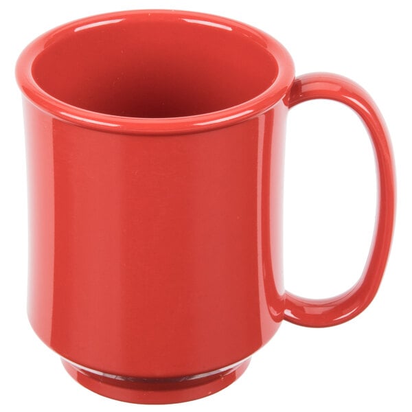 A close-up of a red GET Healthcare Sensation Tritan mug with a handle.