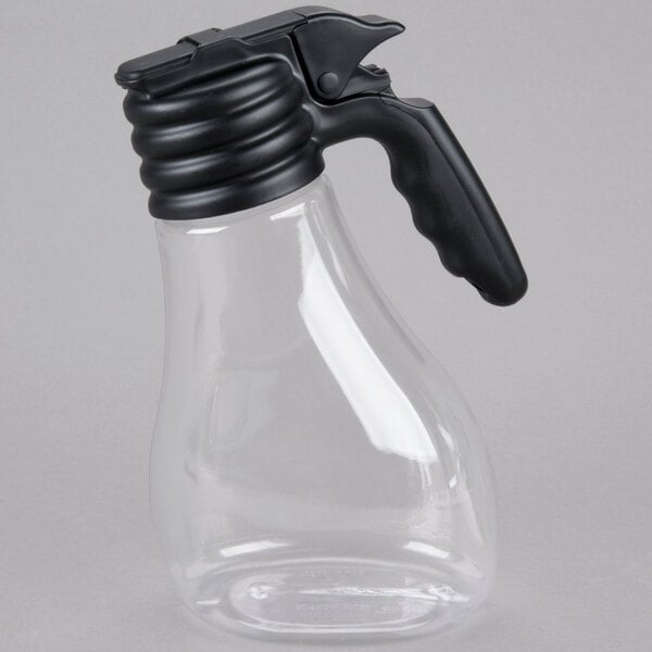 A Tablecraft clear plastic dispenser with a black plastic lid and black tray.