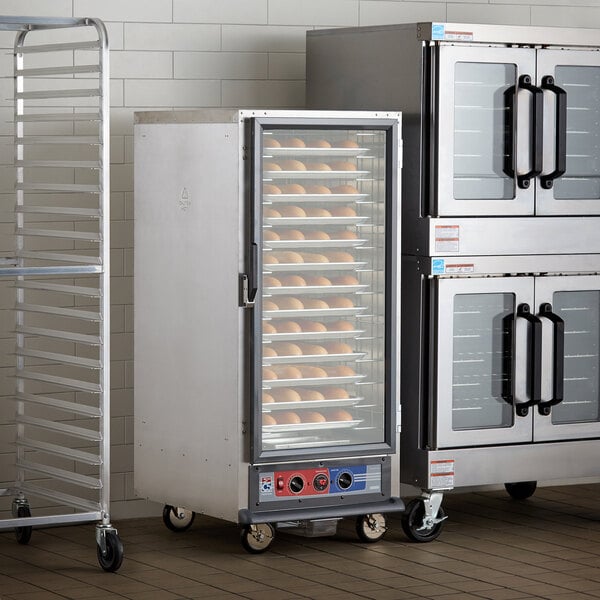 a large commercial oven with a couple of trays of bread