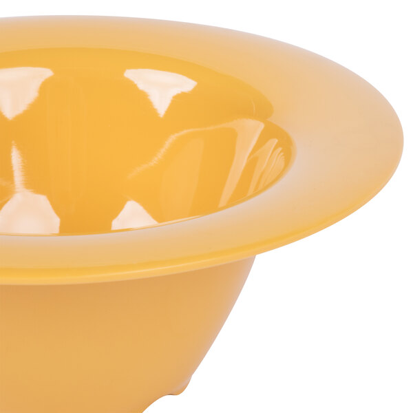 A close up of a yellow GET melamine bowl with a wide rim.